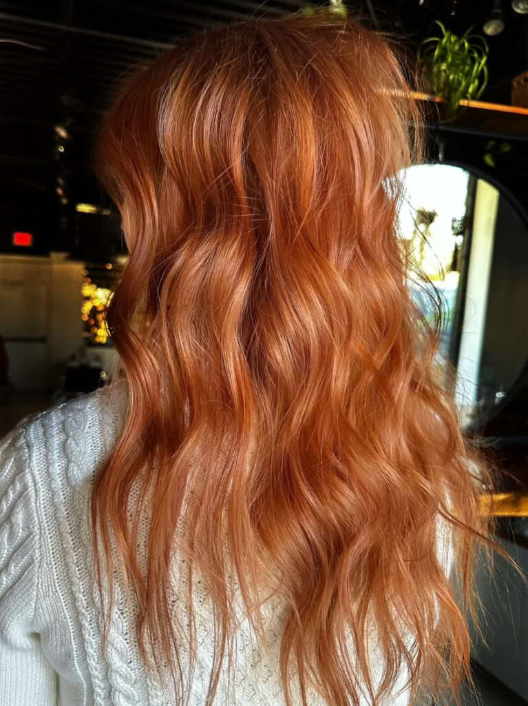 Idea of inspiration picture for client to bring in! Photo shows a picture of beautiful red hair with beachy waves.